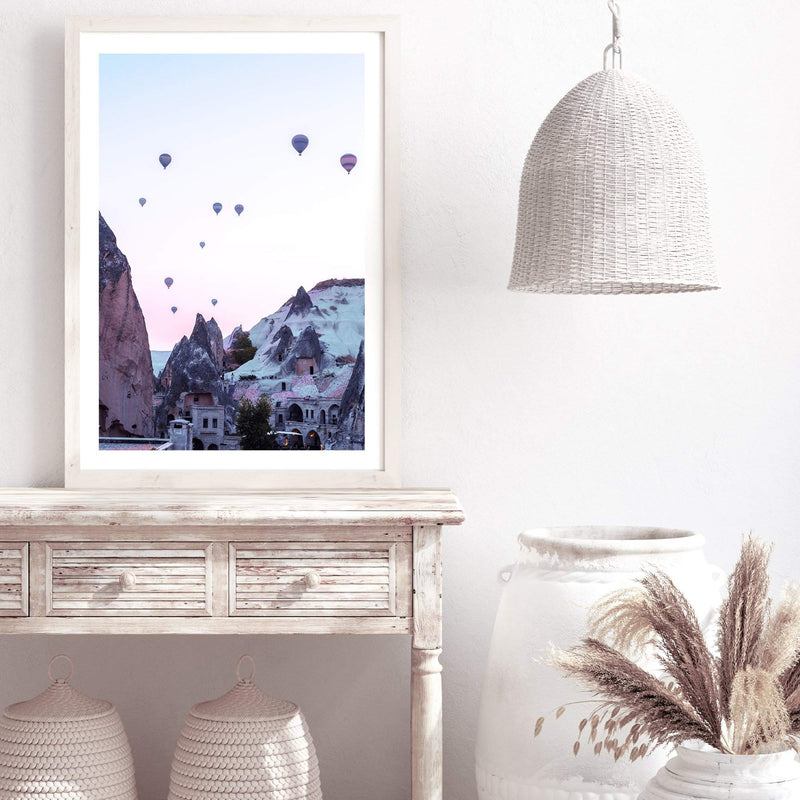 Balloons Over Cappadocia-The Paper Tree-architecture,balloons,cappodocia,city,destination,horizon,hot air balloons,mountains,pink,portrait,premium art print,purple,sunset,town,travel,turkey,villa,wall art,Wall_Art,Wall_Art_Prints